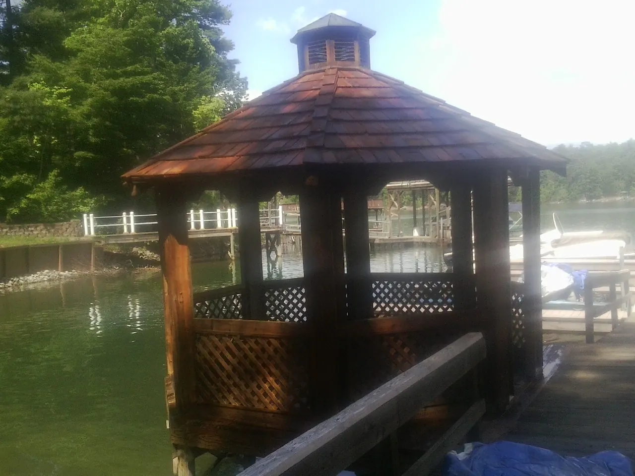Cedar shake gazebo roof rebuilt on a lake dock in Wallsburg