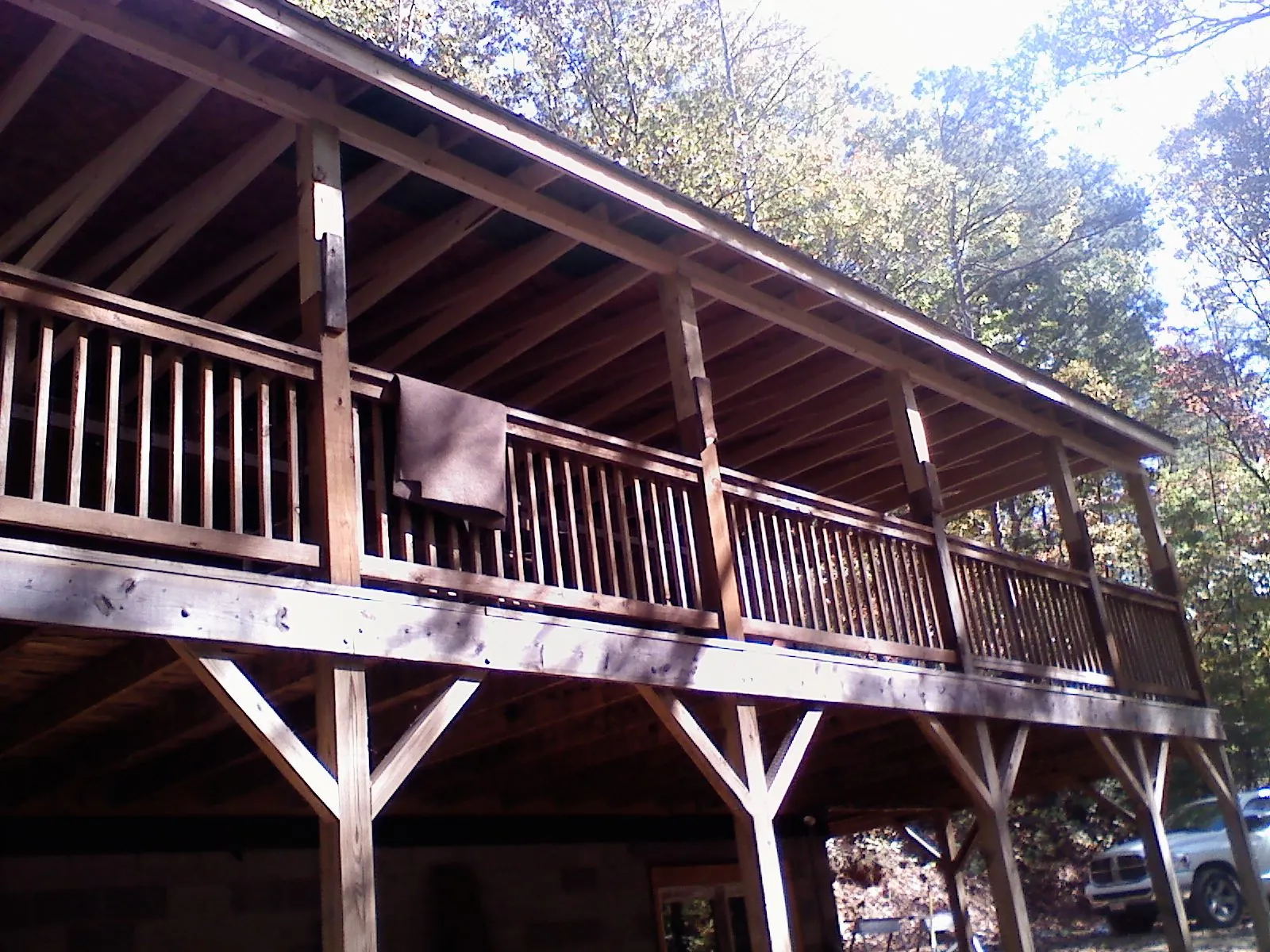 Timber framing under a new elevated porch and deck — Roof Leak Repair in Wallsburg by Roofing Brothers